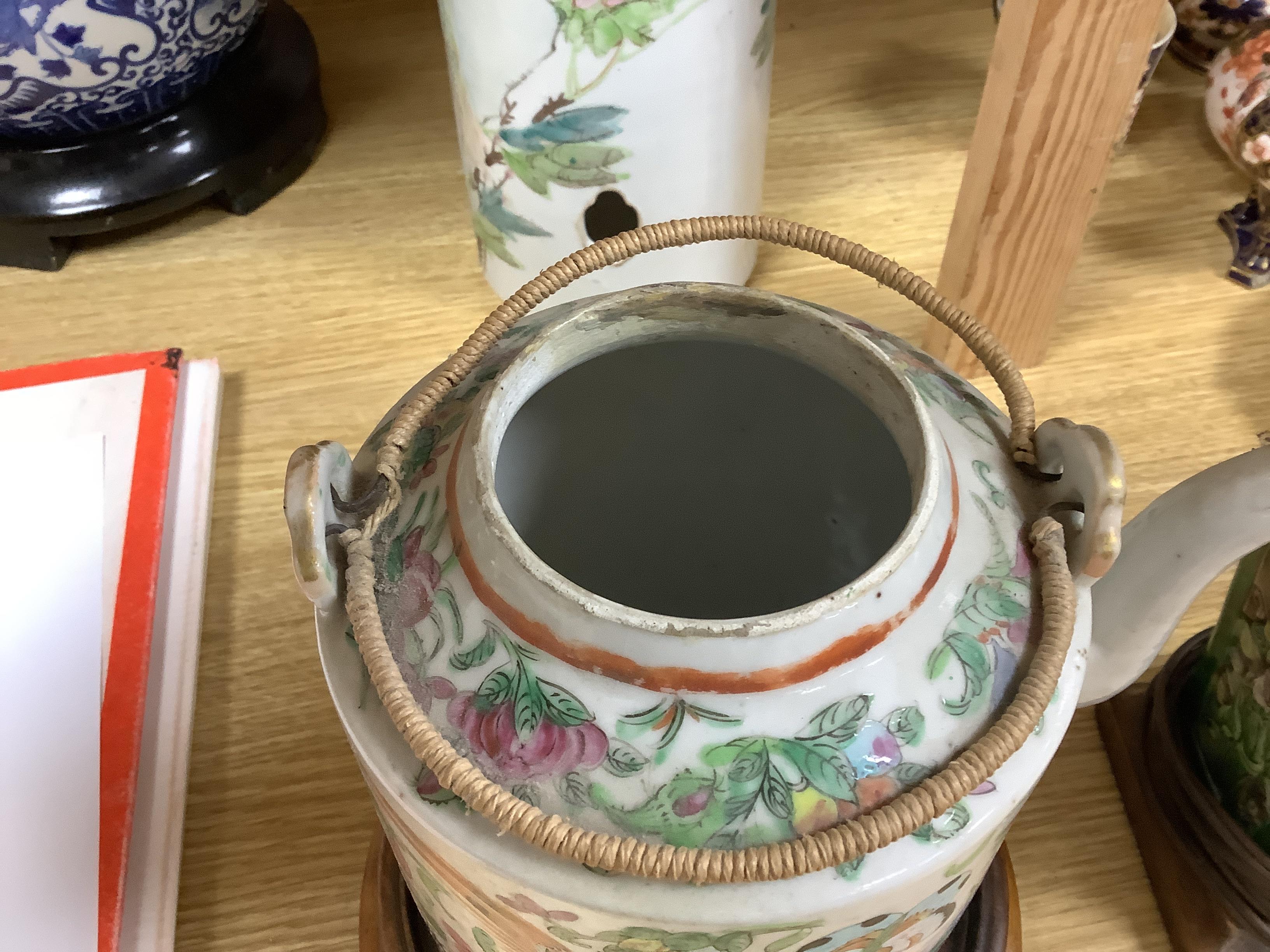 A Chinese famille rose inscribed hat stand and teapot and cover, both late 19th/early 20th century (2) tallest 29cm